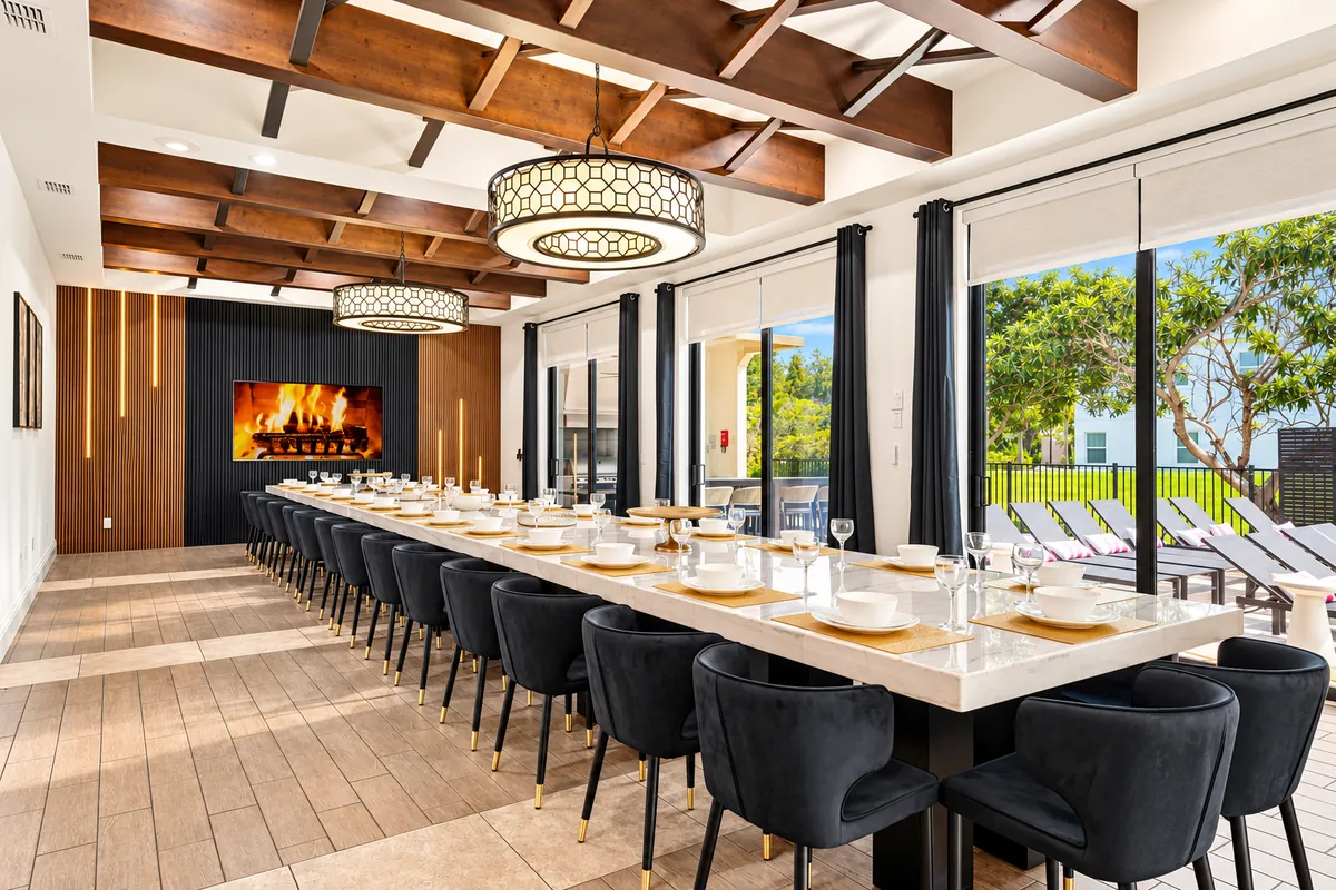 Long dining table set for a shared meal in a luxury vacation home