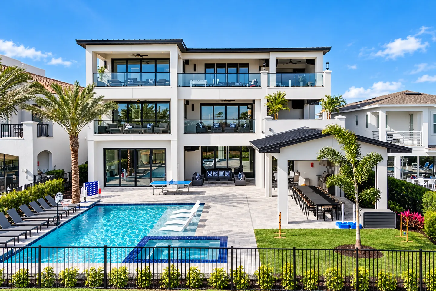 Luxury Florida vacation home with a private pool, sun loungers and covered outdoor dining