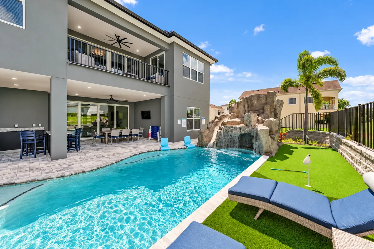 Luxury vacation villa with a private waterfall pool and putting green