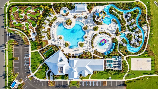 Aerial view of Windsor Cay clubhouse, resort pool, lazy river and water slides